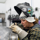 Danae Buschkoetter in her element, welding on the vintage Volvo’s bodywork.